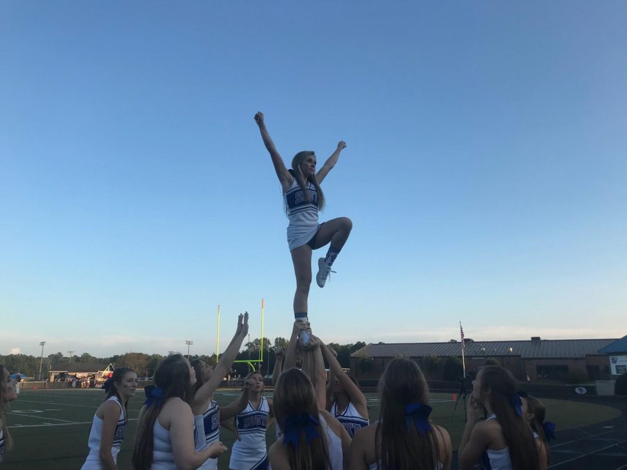 South Forsyths cheer squad hoists their flyer up in the air to ramp up the crowd before the game. The cheerleaders continued to support the War Eagles with spirit and optimism throughout the rest of the game. 