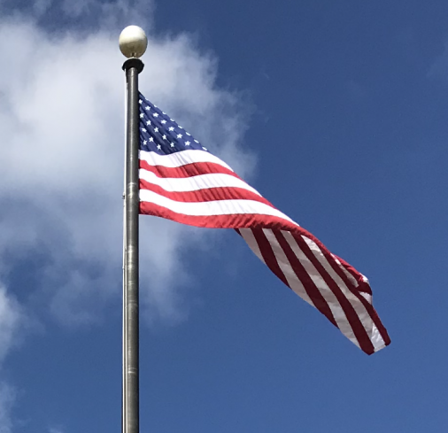 This is the American Flag, symbol of freedom. The flag stands in-front of West hall waving in the air, waiting to be saluted by the students of South.