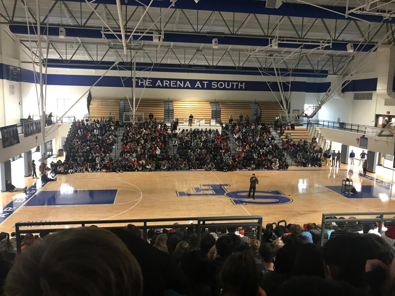 Speaker Logan Weber opens up his presentation about setting and reaching goals in South's Arena this morning. The Arena was packed with students, forcing the faculty to move the projector and screen back and adjust the speakers' rotation.
