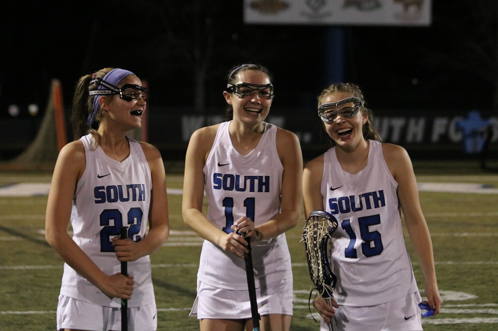 (From left to right: Lexi Kugelman, Morgan Hearn, Avery Wyckoff) The SFHS girls' lacrosse team prepares to start their game against Central.