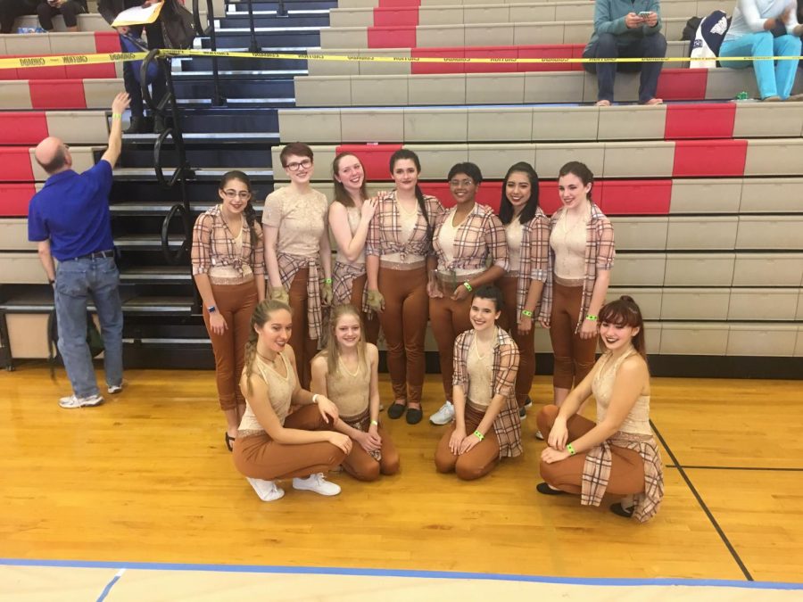 March 17, 2018 - The Winter Guard gather together for a group photo after winning 1st place at the Scholastic Regional A Class competition.