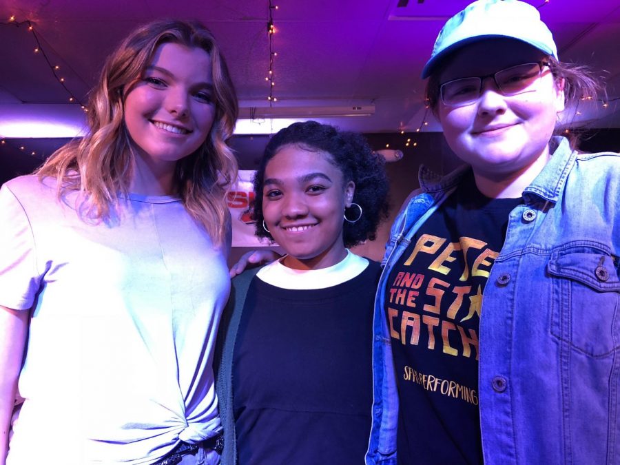 Zoe Maisel (left), Jada  White (center), and Ginny Flory (right) pose for a photograph after performing their poems at the Music Authoritys first ever poetry slam. After preparing for months, they were able to amaze the audience with their powerful words. Jada White earned second place in the competition.