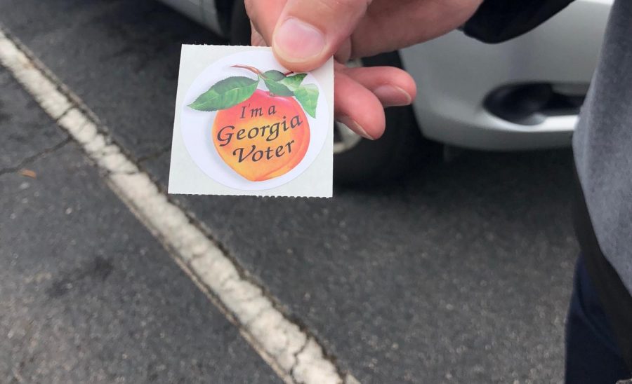 Feelin Peachy. Georgia voter walks out after casting their ballot. Because of the recent midterm election, several voters have been using the media to encourage others to go vote.
