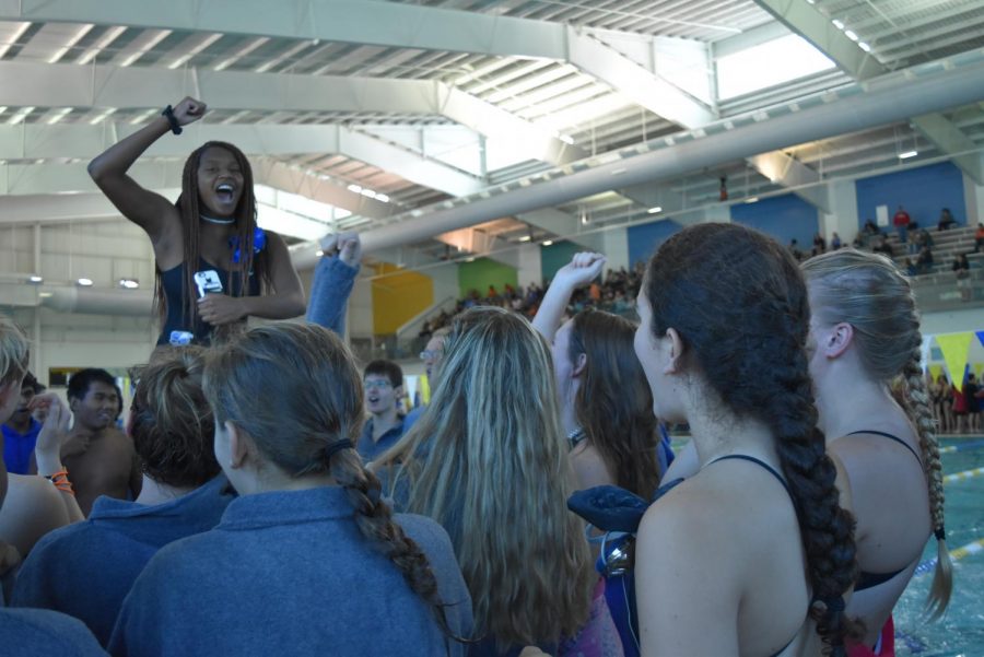 Team Spirit. South Forsyth swim and dive team gather for their first team cheer of the season. The team continued this spirit throughout the meet and continued to work hard. 