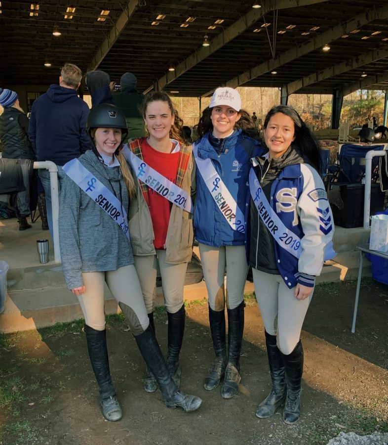 Bearing sashes after victory. From left to right: Hannah Gannon, Emilee Spicer, Cate DeCastro, Alejandra Pena celebrate after the Zone 4 finals. Excluding Hannah Gannon, the other equestrian girls are captains of the equestrian team, with Emilee Spicer as the junior varsity captain. 