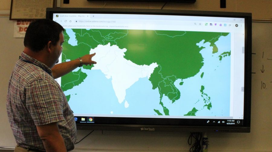 A world of opportunities. Mr. Holmes, a World Geography teacher, often uses the boards to display maps to his class. The boards have changed the way many teachers use their everyday class time.