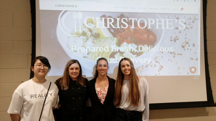 Ready to compete. Charlotte Bythwood poses with Chef Martin, one of South's culinary teachers, and her fellow students on the day of the competition. Bythwood was the first ever Christophe’s Culinary Challenge winner. Her food product, Power Shot, gives consumers quick and long-term energy.