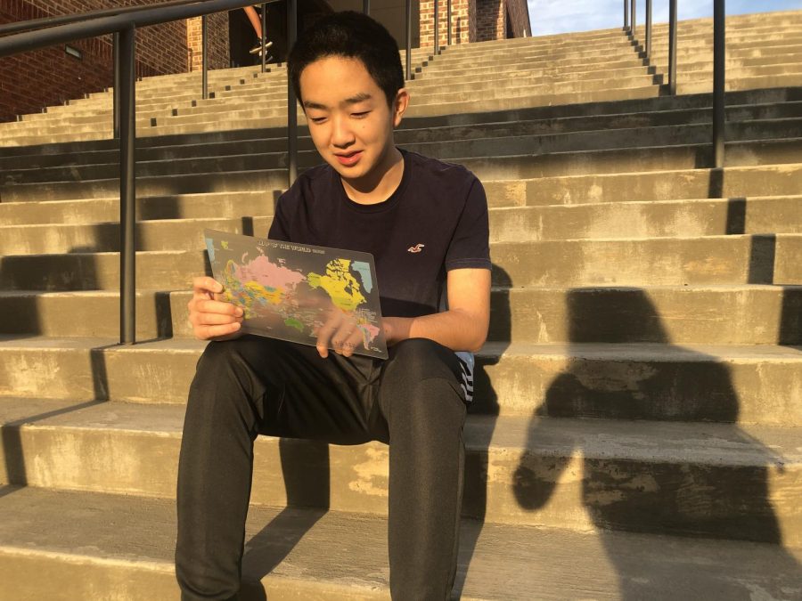 Traveling the globe.  Freshman Takumi Otani looks at a map in wonder of where hell end up next. Considering all the places he has traveled already, his life is full of new adventures and discoveries.