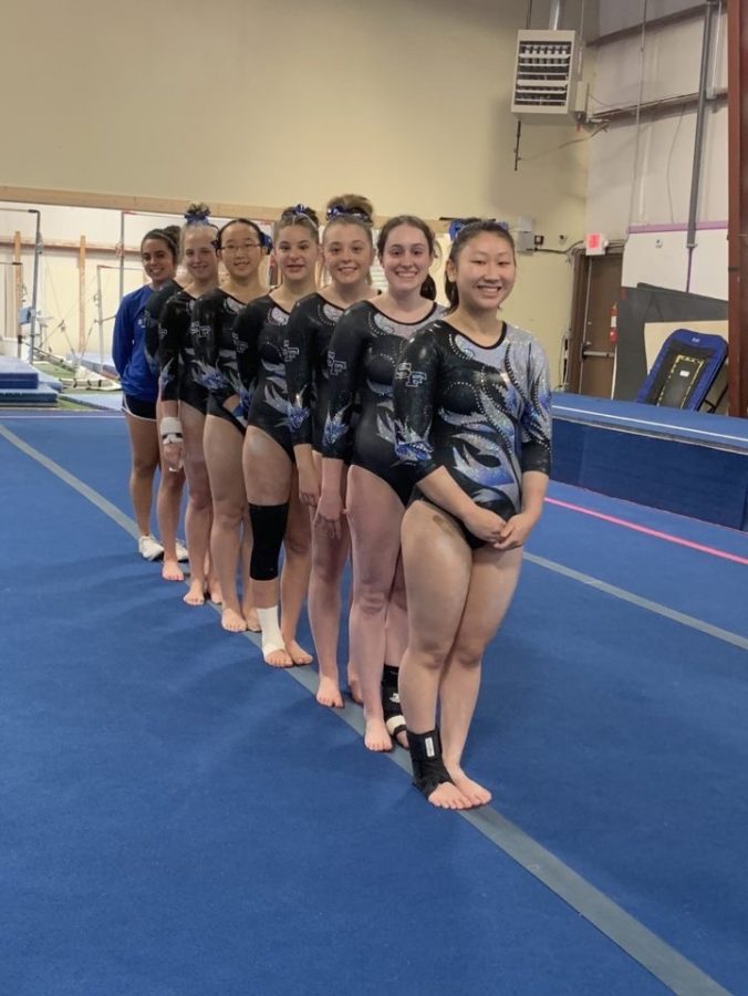 Let the games begin. The South Forsyth Varsity gymnastics team prepares to compete. Senior Sydney Goncalves, junior Emma Knezevich, freshman Abby Molish, freshman Alice Wang, freshman Carina Leftovits, sophomore Avery Sitko, senior Kelsey Watson, and sophomore Lia Carter, patiently awaited the start of the competition where they won second place.