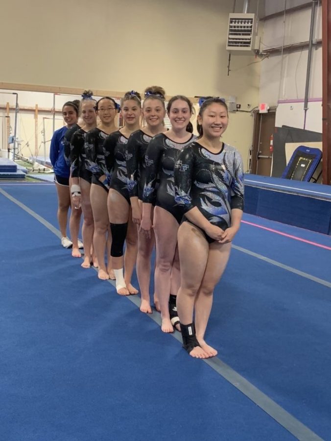 Let+the+games+begin.+The+South+Forsyth+Varsity+gymnastics+team+prepares+to+compete.+Senior+Sydney+Goncalves%2C+junior+Emma+Knezevich%2C+freshman+Abby+Molish%2C+freshman+Alice+Wang%2C+freshman+Carina+Leftovits%2C+sophomore+Avery+Sitko%2C+senior+Kelsey+Watson%2C+and+sophomore+Lia+Carter%2C+patiently+awaited+the+start+of+the+competition+where+they+won+second+place.