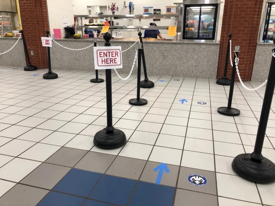 Distancing during lunch. As students come to the dining hall during lunch, there are many new procedures to ensure that each student is safe. For example, as a student is waiting in line, they are spaced out from those around them to be safe.