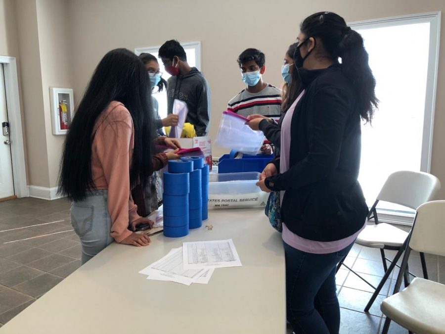Labeling bags. Juniors and seniors gather and label different bags to hold materials which the county will deliver to different counties within the state. Volunteer organizer, Mr. Joel McNatt, made sure each student was able to contribute in the preparation for the upcoming elections