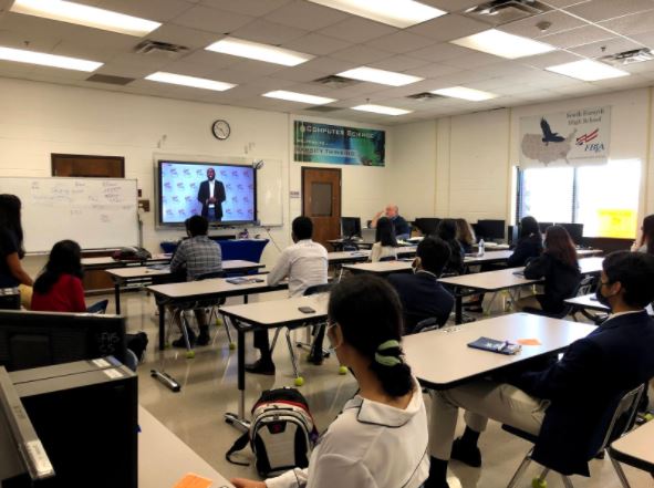 A moment of inspiration. In the above photo, students watch the keynote speaker of FUEL, Bryant Collier.  Officers advised students to sit several feet apart in class, keeping a socially distanced environment. Bryant Collier was a former FBLA member, who won several awards and gained recognition for his public speaking skills. Throughout his speech, that was casted on screens all over high schools in Georgia, he encouraged students to find their passion through organizations like FBLA, and build a career off of doing what they love. 