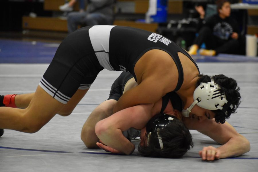 South wrestler Juan Cruz and Walnut Grove wrestler Kale Griswell in the second period. Cruz fights a hard first two periods and is leading by four points. In the third period, Griswell pins Cruz at five minutes and three seconds. 