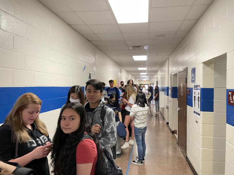 Seniors crowded in West Hall. The anticipation is real. Seniors lined the halls out the door to purchase prom tickets. (This last sentence you wrote almost sounds similar to what you said in the beginning of your caption)