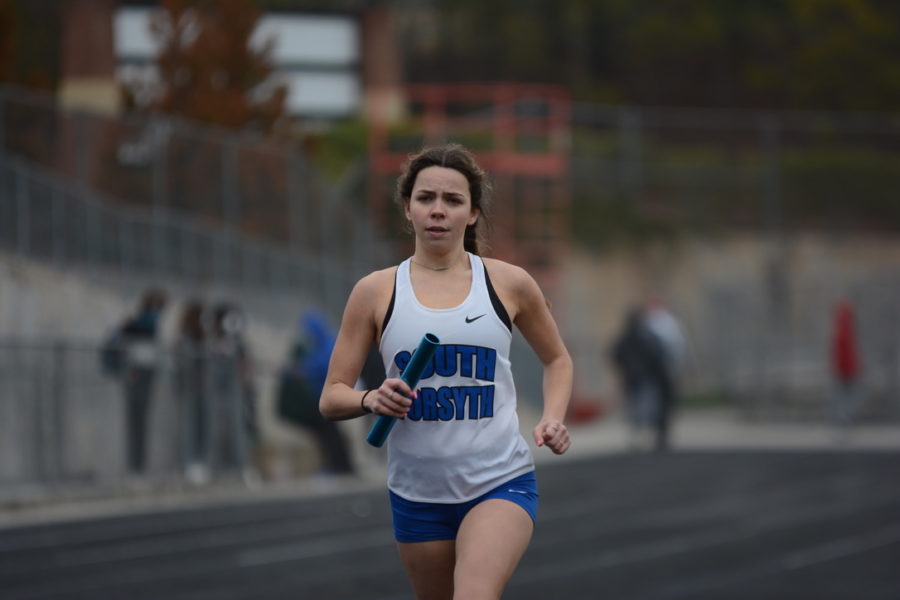 4x8 (2 laps: 4 people run) relay. Senior Ansley Rogers is sprinting down the last 100m straight as she competes in the 4x8 relay. Senior Madi Butler, Senior Katelyn Mclean, and Sophomore Emily Barnes competed with her as well.