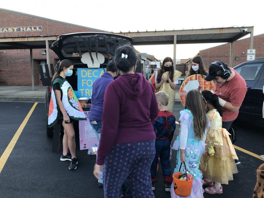 Fantastic food carnival. SFHS DECA officers dress up in delicious food costumes to fit the theme of their truck. As they handed out candy, the families loved how interactive their trunk was.

