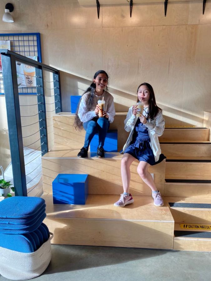 (Pictured above from left to right) Unique seating. Senior Shriya Nayak and junior Jelovy Djaja drink their favorite boba drinks as they hangout on the staircase seating. Unlike other cafes, this unique seating allows individuals to 