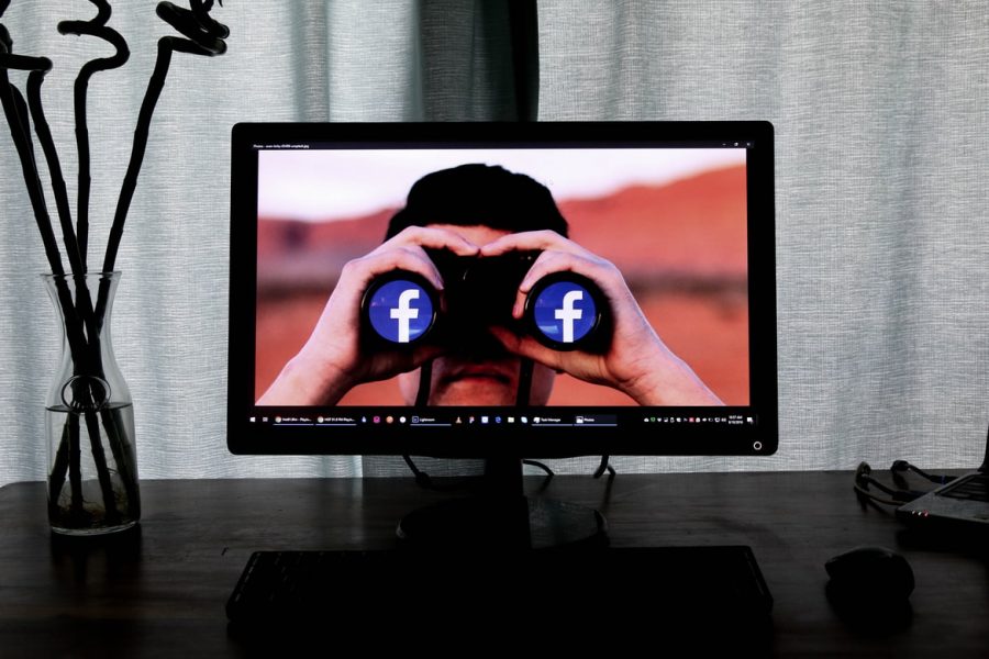 Facebook binoculars. The young man on the screen stares into your soul through the lens of Facebook. You wondered, how much of me do they really see and control? 