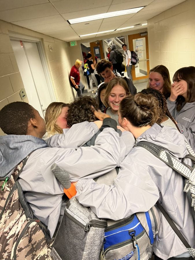 Meaningful memories. As the swim team finishes up their state meet, the swimmers give each other a big hug as this is the ending of one chapter and the beginning of another chapter. This hug emphasized their strong connection as the seniors get ready to take on their future journey.