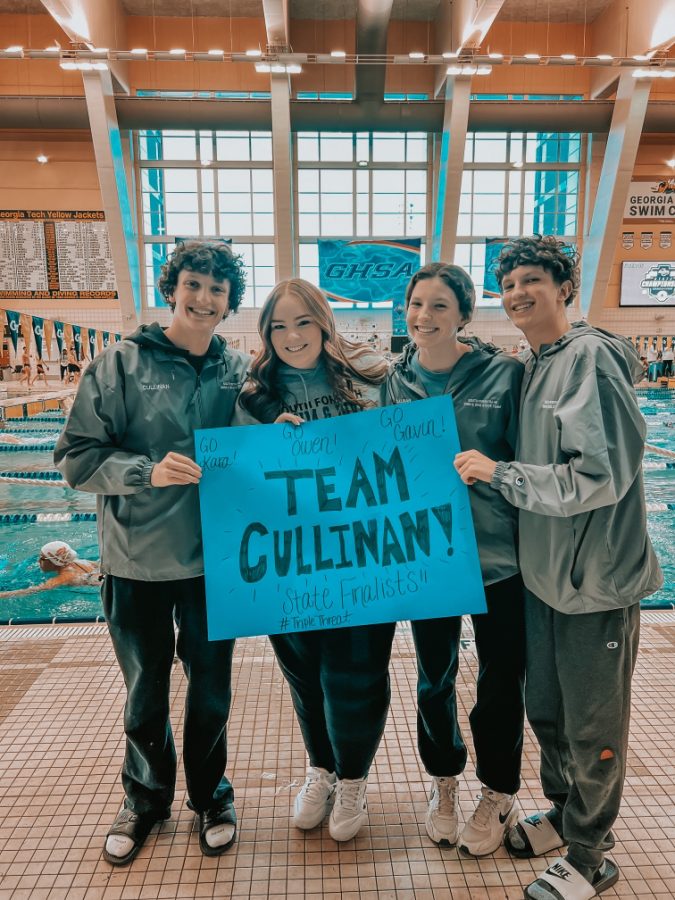 The triple threat. (Pictured above from left to right) Senior Gavin Cullinan, Coach Loggins, freshman Kara Cullinan, and senior Owen Cullinan pose for a picture as they get ready to compete in the finals for their personal events. This sibling trio has positively impacted the team in more ways than one, and the seniors will most definitely be missed.