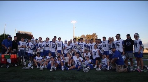 Go War Eagles. Souths lacrosse team pose for a photo at the War Eagle Stadium. The team practiced for several hours to get prepared for the 2022 spring season.