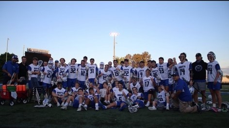 Go War Eagles. South's lacrosse team pose for a photo at the War Eagle Stadium. The team practiced for several hours to get prepared for the 2022 spring season.