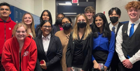 Celebrating Success. SFHS Mock Trial students pose for a picture with post-competition excitement. After the competition, the club members were looking forward to and anticipating their results.