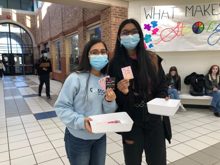 Youve got a pizza of my heart. Senior leaders Shree Delwadia and Swetha Pendela (pictured from left to right) pass out Valentines day cards filled with many puns. They gave cards to various students and teachers to share the love on this special day.