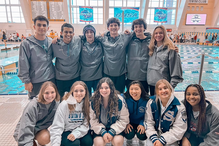 Senior spotlight. Souths senior seniors crowd together as they make their last memories as a war eagle swimmer. Ready to win, the seniors were emotional as they entered their last high school swim meet.
