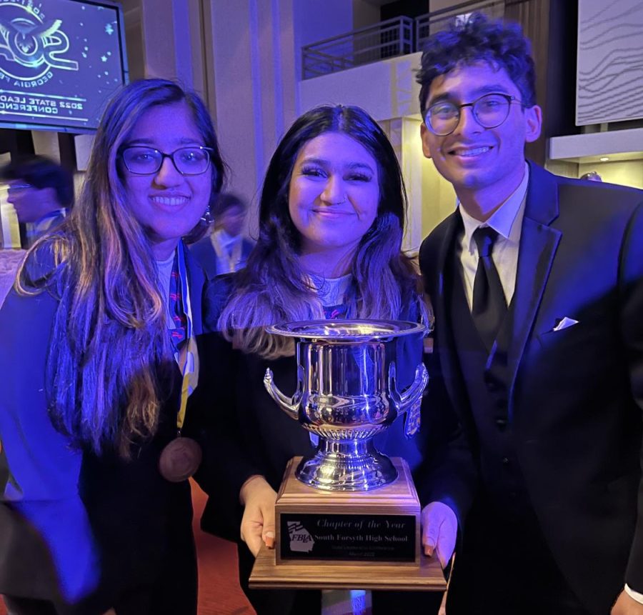 Long-awaited victory. Chapter President Shivani Murugapiran, Vice President Shreya Mishra, and State Officer Abhishek Pasupuleti present the Chapter of the Year cup. The hard work of all members and officers led to remarkable wins.