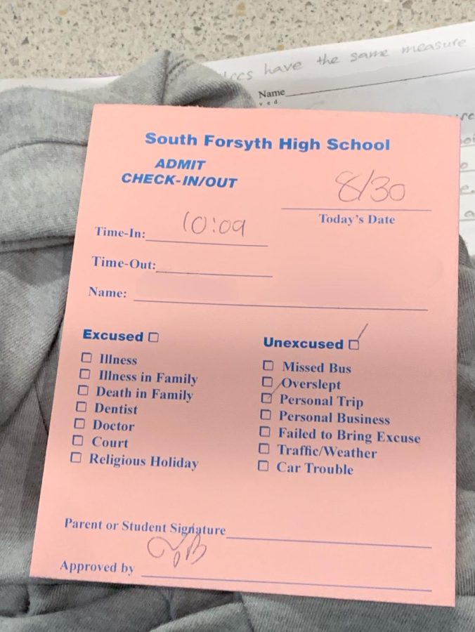The 2022-23 school years tardy slips are a light salmon color.