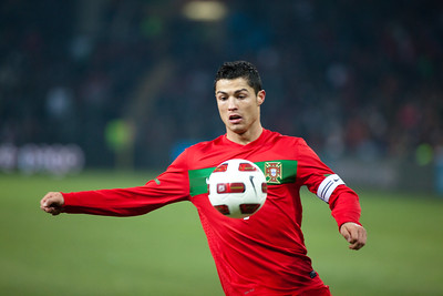 Christiano Ronaldo playing soccer in the stadium for his club team. Ronaldo recently signed a deal with Saudi Arabia for a record-breaking amount of money.