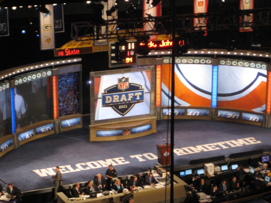 Every year, NFL hopefuls find out their fate through a night of surprise and celebration that is the NFL Draft. (NFL Draft 2011 by mjpeacecorps is licensed under CC BY-NC 2.0.)
