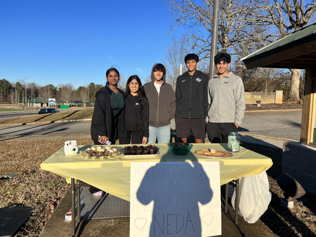 South Forsyth High Schools HOSA Students at a Bake Sale for their campaign to raise awareness for eating disorders. Through the support of their community, the students were able to raise money for NEDA. 