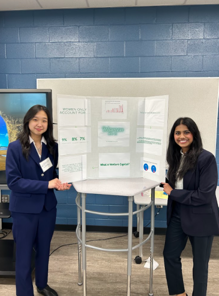Grace Chin (left) and Sritha Neeli (right) are presenting an informational poster pertaining to women in Venture Capital.