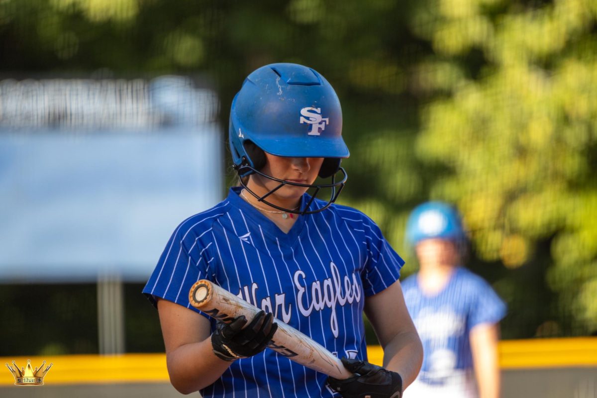 Junior Madison Stovoken holding her white Easton softball bat while preparing to bat on the on-deck-circle at South Forsyth High Schools Region game against Forsyth Central High School