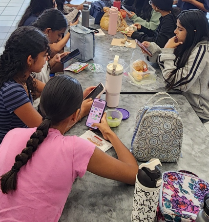 South Forsyth High School students glued to their screens across the entire lunch table.