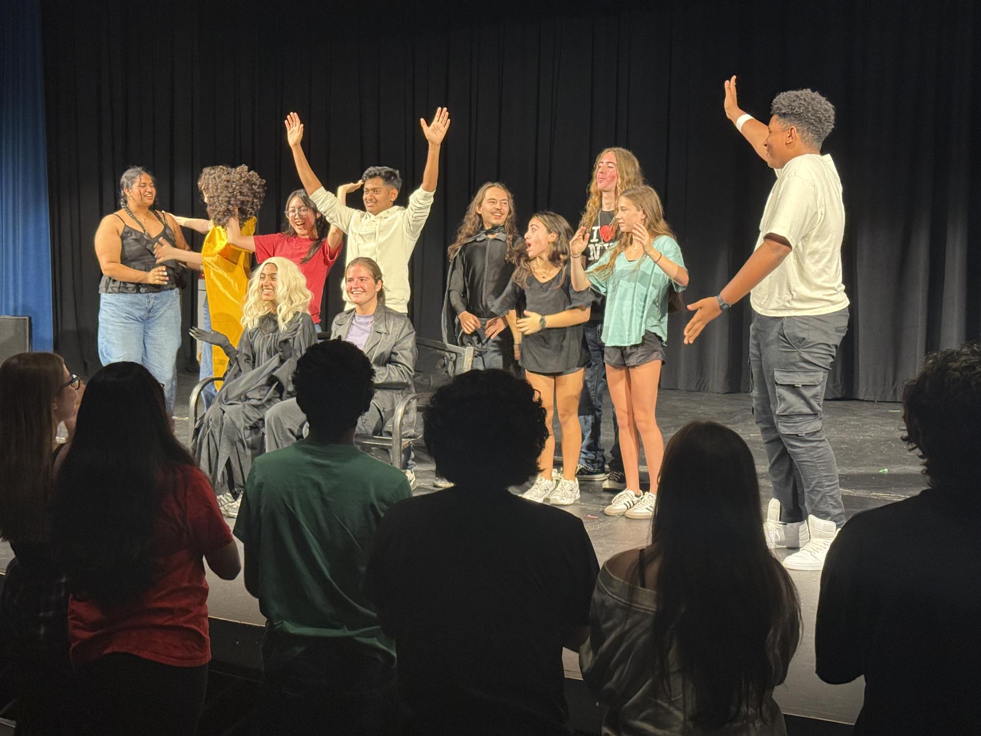 The actors of Mason's play, "Superheroes" rejoice after a successful performance. (Photo by Caroline Wolff)